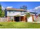 Traditional two-story home featuring a brick and siding exterior with green grass and a driveway at 531 Luzon Ave, Tampa, FL 33606