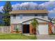 Charming two-story home with a brick facade, well-manicured lawn, and an American flag at 531 Luzon Ave, Tampa, FL 33606