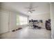 Bright home office featuring tiled floors, neutral walls, a ceiling fan and a large window at 531 Luzon Ave, Tampa, FL 33606