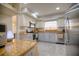 Bright kitchen with stainless steel appliances, granite countertops, and updated cabinets at 531 Luzon Ave, Tampa, FL 33606