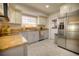 Well-lit kitchen with stainless steel appliances, granite countertops, and a window view at 531 Luzon Ave, Tampa, FL 33606