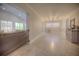 Open-concept living space with tiled floors, neutral walls, flowing from one room to the next at 531 Luzon Ave, Tampa, FL 33606