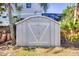 Backyard shed with double doors for storing lawn and garden equipment at 531 Luzon Ave, Tampa, FL 33606