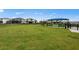 Well-maintained community dog park with a spacious grassy area and seating for residents at 5622 Silverside Pine Ct, Lakewood Ranch, FL 34211