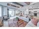Spacious living room with exposed beams, a comfortable seating area, and an open layout at 5622 Silverside Pine Ct, Lakewood Ranch, FL 34211