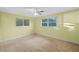 Bedroom with carpeted floors and natural light at 625 Commiston Ln, Lutz, FL 33549