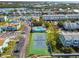 Aerial view of community pool, tennis courts, and parking at 649 Garland Cir, Indian Rocks Beach, FL 33785