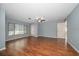 Spacious bedroom with a ceiling fan and laminate wood floors at 700 Starkey Rd # 1111, Largo, FL 33771