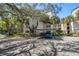 Condominium complex with covered parking and mature landscaping at 700 Starkey Rd # 1111, Largo, FL 33771