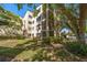 Charming condo building featuring private balconies and mature landscaping at 700 Starkey Rd # 1111, Largo, FL 33771