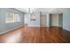 Bright living room featuring an open floorplan, hardwood floors, and natural light at 700 Starkey Rd # 1111, Largo, FL 33771