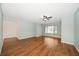 Bright living room with a ceiling fan and laminate wood floors at 700 Starkey Rd # 1111, Largo, FL 33771