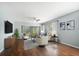 Bright living room with hardwood floors, neutral walls, and natural light at 700 Starkey Rd # 1111, Largo, FL 33771