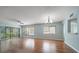 Bright living room with hardwood floors, ceiling fan and natural light at 700 Starkey Rd # 1111, Largo, FL 33771