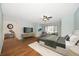 Spacious main bedroom with ceiling fan and seating area at 700 Starkey Rd # 1111, Largo, FL 33771