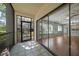 Covered patio with screened windows offering views of the living room at 700 Starkey Rd # 1111, Largo, FL 33771