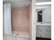 Bathroom shower with pink tile and glass door at 700 Starkey Rd # 1111, Largo, FL 33771