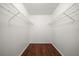Walk-in closet with laminate wood floors and wire shelving at 700 Starkey Rd # 1111, Largo, FL 33771