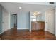 Open wet bar area featuring wood cabinets and laminate floors at 700 Starkey Rd # 1111, Largo, FL 33771