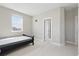 Minimalist bedroom filled with light features modern decor and a twin bed at 7811 Roma Dune Dr, Wesley Chapel, FL 33545