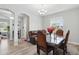 Cozy dining room featuring a stylish table setting and plenty of natural light at 7811 Roma Dune Dr, Wesley Chapel, FL 33545