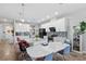 Modern kitchen with white cabinets, a large center island, and stainless steel appliances for the home chef at 7811 Roma Dune Dr, Wesley Chapel, FL 33545