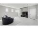 Bright media room featuring a large television, comfortable seating, and neutral decor at 7811 Roma Dune Dr, Wesley Chapel, FL 33545