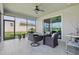 Enjoy this relaxing screened patio with outdoor dining area and a view at 7811 Roma Dune Dr, Wesley Chapel, FL 33545