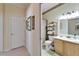 Bright bathroom with a vanity, shower-tub combo, and tasteful decorations at 8141 Ambersweet Pl, Land O Lakes, FL 34637