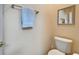 Neutral-toned bathroom with a toilet and towel rack, offering essential amenities in a simple setting at 8141 Ambersweet Pl, Land O Lakes, FL 34637