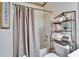 Cozy bathroom with a shower-tub combo, decorative towels, and a neutral color palette at 8141 Ambersweet Pl, Land O Lakes, FL 34637
