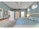 Serene bedroom featuring soft blue tones, a cozy bed, and ample natural light at 8141 Ambersweet Pl, Land O Lakes, FL 34637