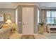 Inviting foyer with a white front door, neutral walls, and decorative accents, offering a warm welcome at 8141 Ambersweet Pl, Land O Lakes, FL 34637