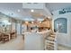 Kitchen with light wood cabinets and an open bar top with seating at 8141 Ambersweet Pl, Land O Lakes, FL 34637