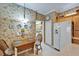 Quaint kitchen nook with a vintage table set, custom wallpaper, and bright light fixture at 8141 Ambersweet Pl, Land O Lakes, FL 34637