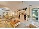 Spacious living room with open layout and tile floors, flowing into dining and kitchen areas at 8141 Ambersweet Pl, Land O Lakes, FL 34637