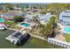 A waterfront home boasts a screened pool, boat dock and lift for easy access to waterways at 8448 Flagstone Dr, Tampa, FL 33615