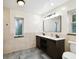 Stylish bathroom featuring double vanity and black fixtures at 8448 Flagstone Dr, Tampa, FL 33615
