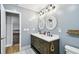 Stylish bathroom featuring a double vanity, modern fixtures, and blue paint at 8448 Flagstone Dr, Tampa, FL 33615