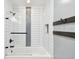 Modern bathroom featuring a shower-tub combo with white tile and sleek hardware at 8448 Flagstone Dr, Tampa, FL 33615