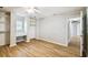 Bright bedroom features wood floors, a built-in desk, and closet at 8448 Flagstone Dr, Tampa, FL 33615
