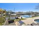 Relax near the pool and intercoastal waterway on a patio with canal and dock access at 8448 Flagstone Dr, Tampa, FL 33615