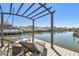 Enjoy relaxing near the intercoastal waterway from the dock that features an overhead shade at 8448 Flagstone Dr, Tampa, FL 33615