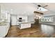 Bright, open kitchen featuring a large island, granite countertops, and hardwood floors at 8448 Flagstone Dr, Tampa, FL 33615