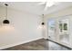 Bright living room with polished concrete floors and pendant lighting at 8448 Flagstone Dr, Tampa, FL 33615