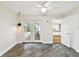 Bright living room with polished concrete floors, ceiling fan, and sliding glass doors at 8448 Flagstone Dr, Tampa, FL 33615