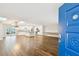 Bright, open living space featuring light-filled kitchen and hardwood flooring at 8448 Flagstone Dr, Tampa, FL 33615