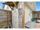 A full shot of the outdoor shower that features a shower head and privacy fence at 8448 Flagstone Dr, Tampa, FL 33615