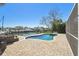 View of the kidney-shaped pool and patio with canal access and boat lift at 8448 Flagstone Dr, Tampa, FL 33615