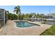 Enjoy outdoor living with a kidney-shaped pool that has canal access and a boat lift at 8448 Flagstone Dr, Tampa, FL 33615